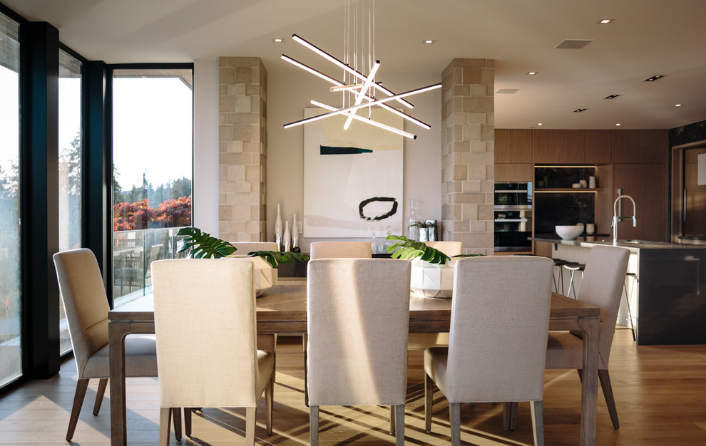 Large contemporary dining room in Vancouver with medium hardwood floors.