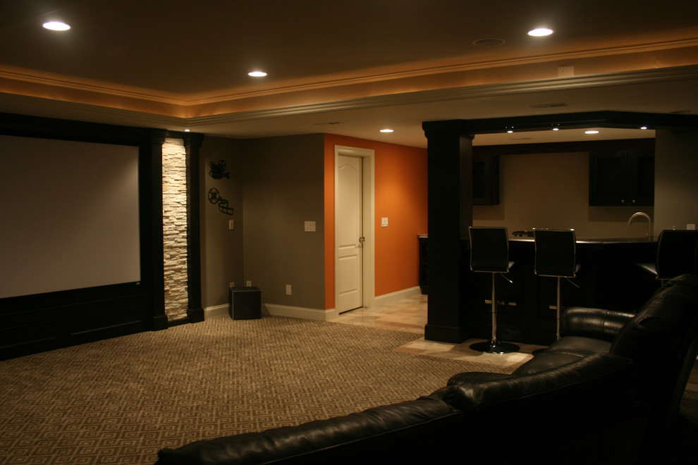 This is an example of a mid-sized contemporary open concept home theatre in Detroit with grey walls, carpet and a projector screen.