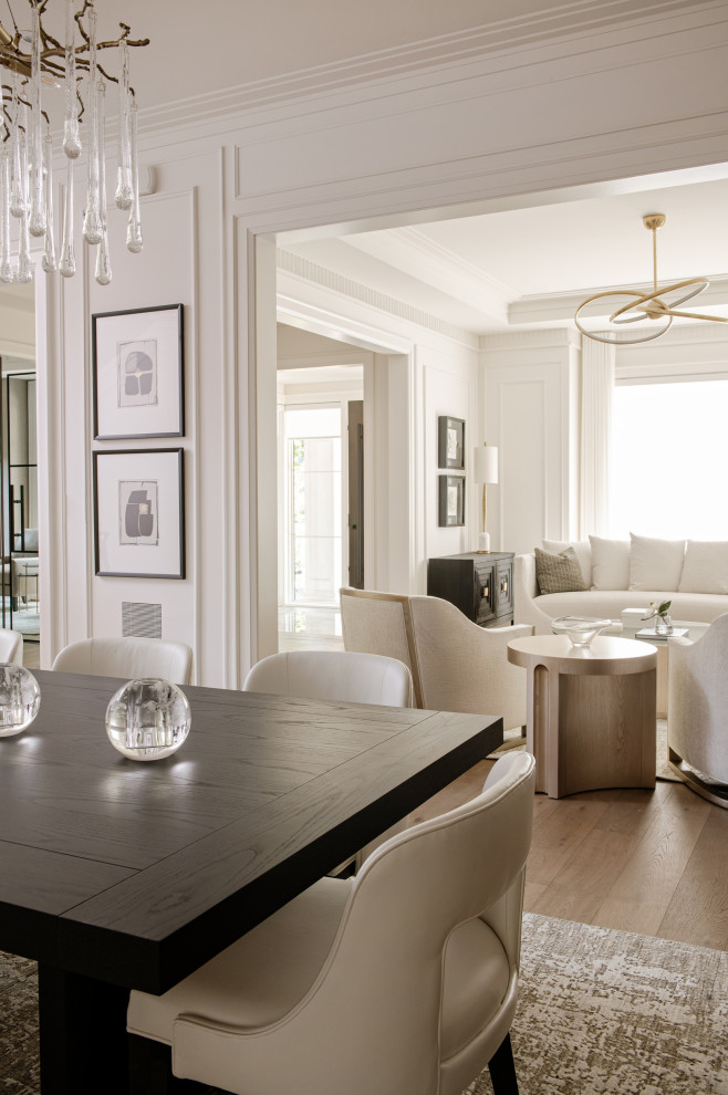 Inspiration for a large transitional light wood floor and wall paneling great room remodel in Toronto with white walls