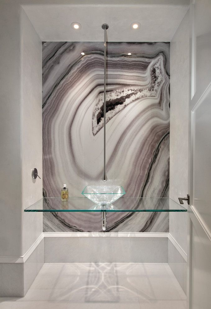 Photo of a powder room in Miami with multi-coloured walls, a vessel sink and glass benchtops.