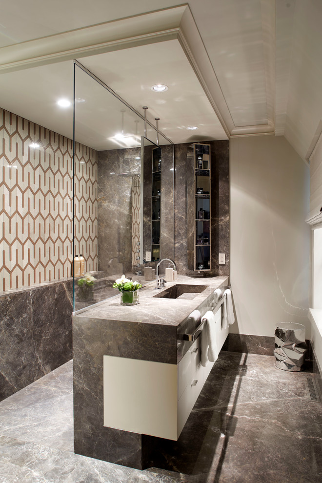This is an example of a contemporary bathroom in Montreal with flat-panel cabinets, white cabinets, an open shower, multi-coloured tile, white walls, an integrated sink and an open shower.