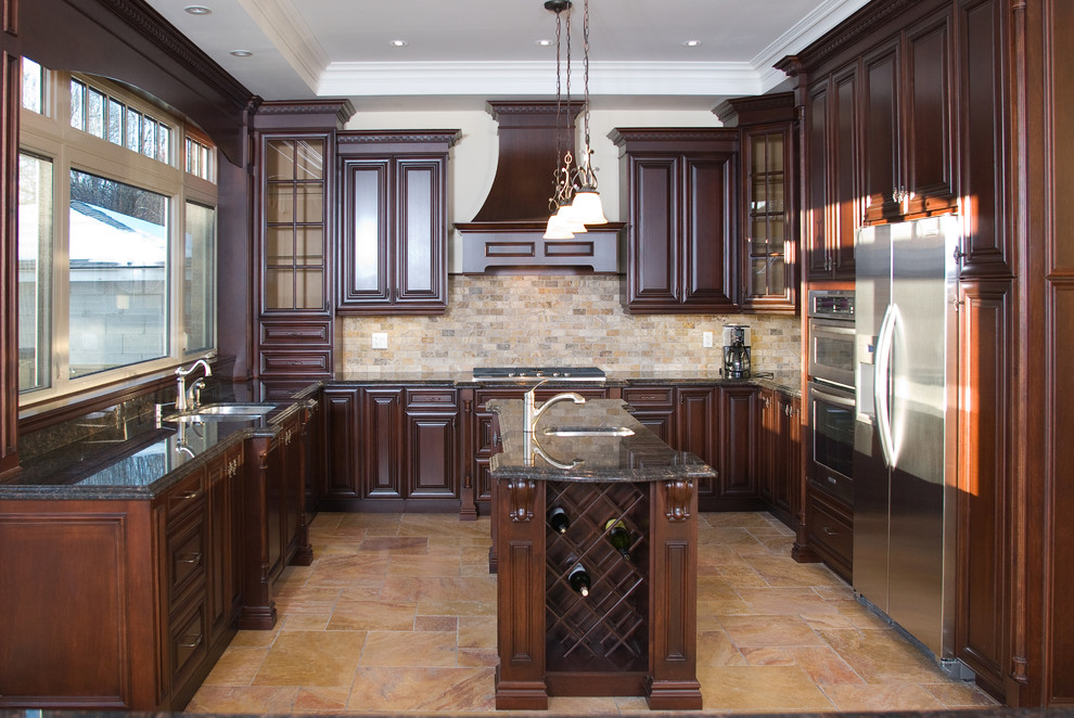 Inspiration for a large traditional u-shaped eat-in kitchen in Toronto with an undermount sink, beaded inset cabinets, white cabinets, granite benchtops, black splashback, stone tile splashback, panelled appliances, travertine floors and with island.