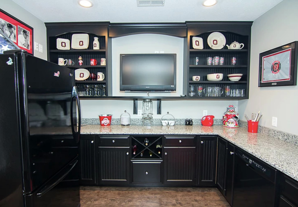 Enclosed kitchen - small transitional u-shaped brown floor enclosed kitchen idea with an undermount sink, louvered cabinets, black cabinets, black appliances, no island and gray countertops