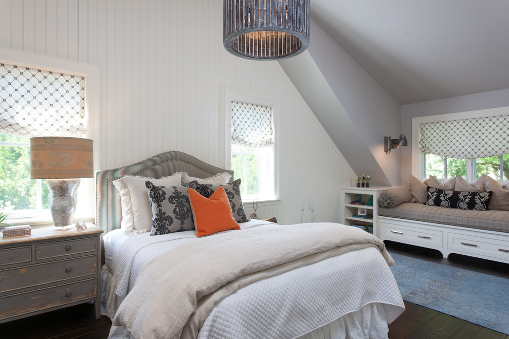 This is an example of a country bedroom in San Francisco with white walls, dark hardwood floors and no fireplace.