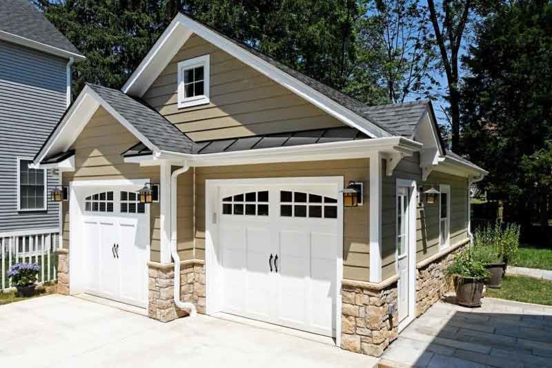 Design ideas for a mid-sized traditional detached two-car garage in New York.