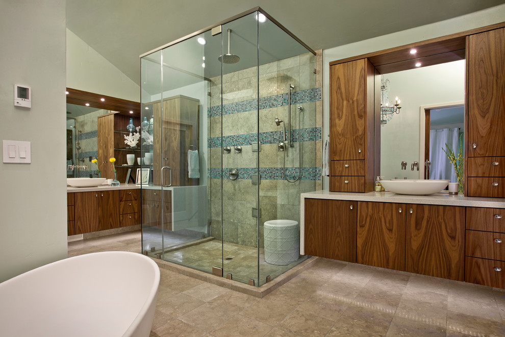 Photo of a contemporary bathroom in Sacramento with a vessel sink, flat-panel cabinets, medium wood cabinets, marble benchtops, a freestanding tub, an alcove shower, multi-coloured tile and grey walls.