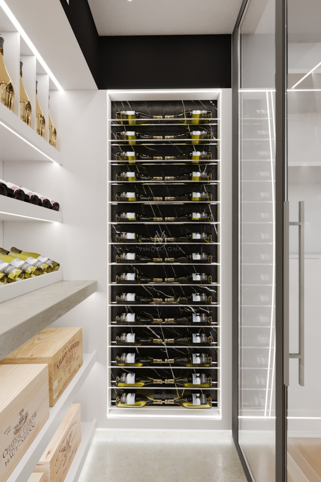 Inspiration for a mid-sized modern wine cellar in London with marble floors, display racks and white floor.