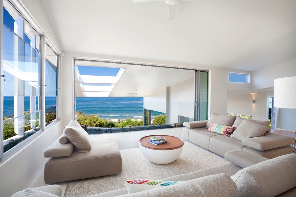 Large contemporary open concept living room in Sunshine Coast with white walls.