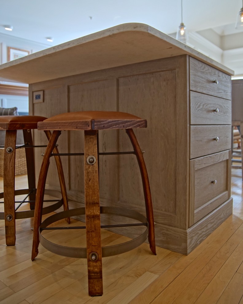 Mid-sized transitional l-shaped medium tone wood floor and beige floor eat-in kitchen photo with an undermount sink, beaded inset cabinets, distressed cabinets, marble countertops, gray backsplash, ceramic backsplash, stainless steel appliances, an island and white countertops