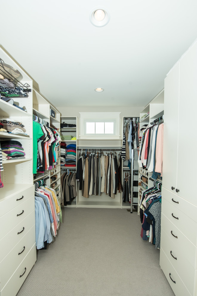 Large traditional gender-neutral walk-in wardrobe in Other with open cabinets, white cabinets, carpet and grey floor.