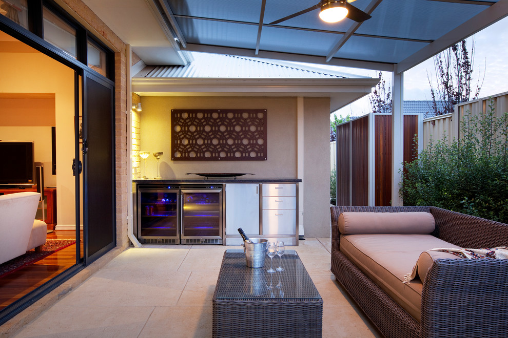 Photo of a mid-sized contemporary backyard patio in Perth with a roof extension.