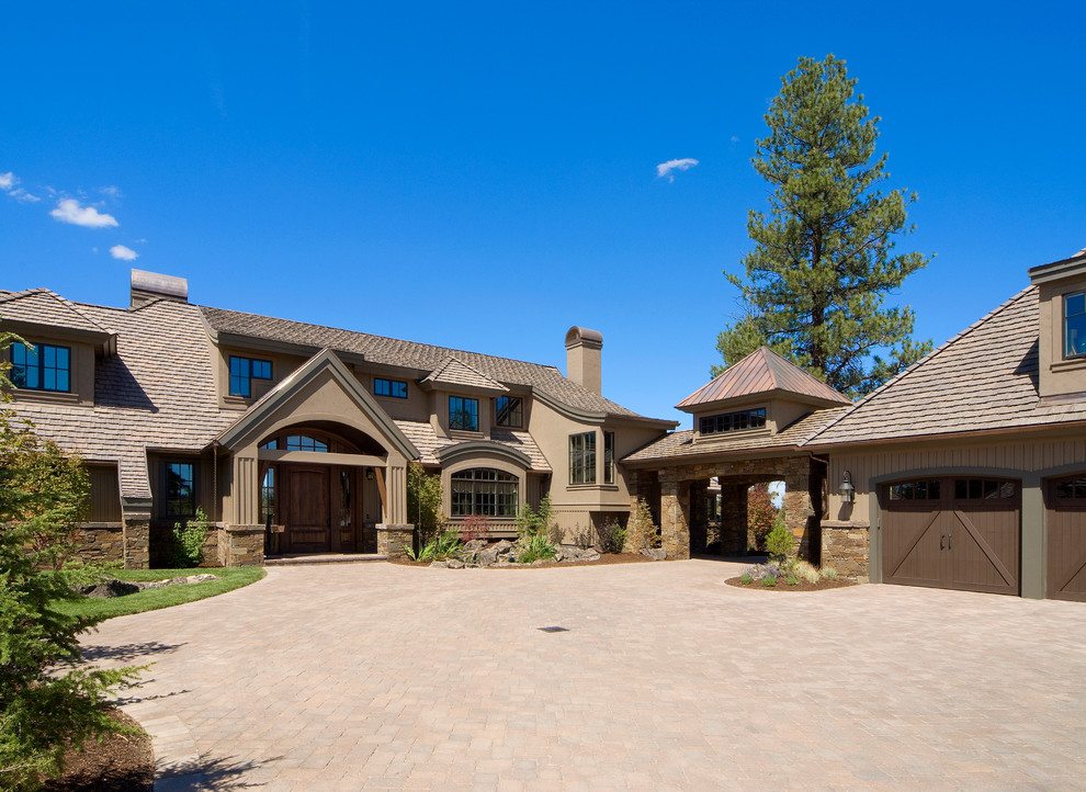 Mountain style two-story stone exterior home photo