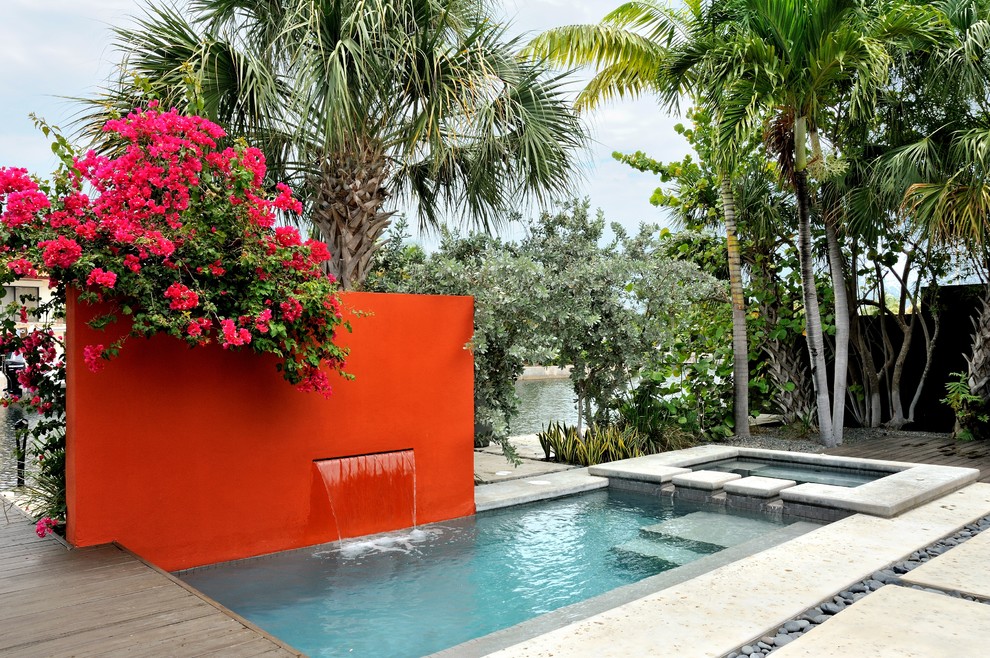 This is an example of a small contemporary rectangular pool in Miami.