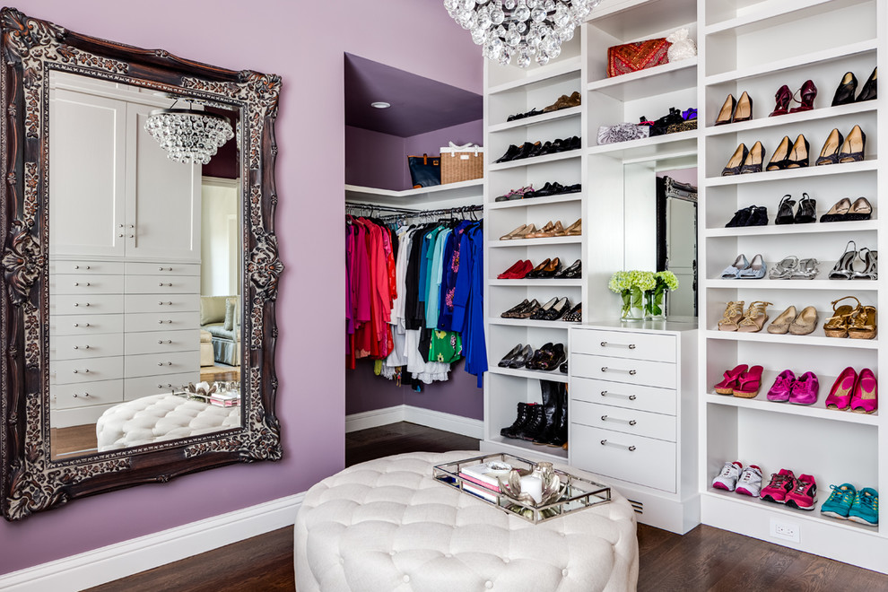 Contemporary women's dressing room in San Francisco with open cabinets, white cabinets, dark hardwood floors and brown floor.