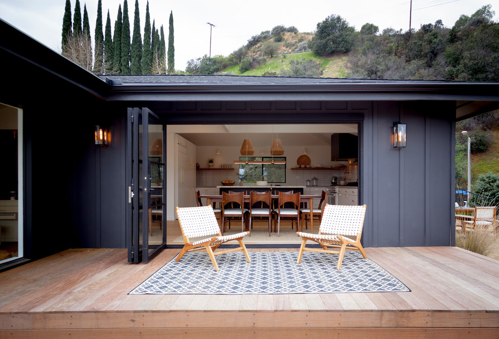 Design ideas for a mid-sized midcentury backyard deck in Los Angeles with no cover.