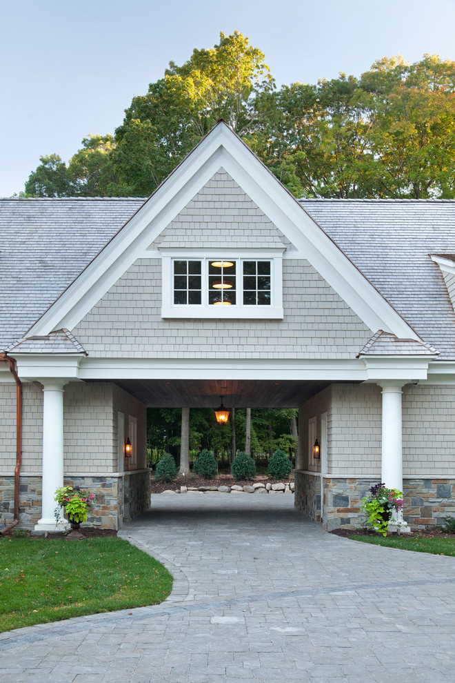 Traditional exterior in Minneapolis with stone veneer and a gable roof.