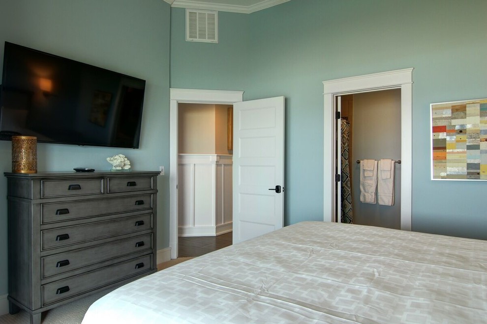 Design ideas for a mid-sized beach style guest bedroom in Other with blue walls, carpet and no fireplace.