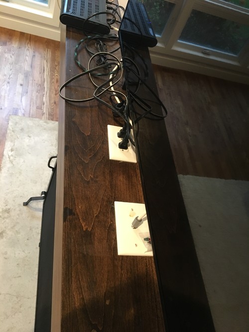 Hiding cords from outlets on a fireplace mantle