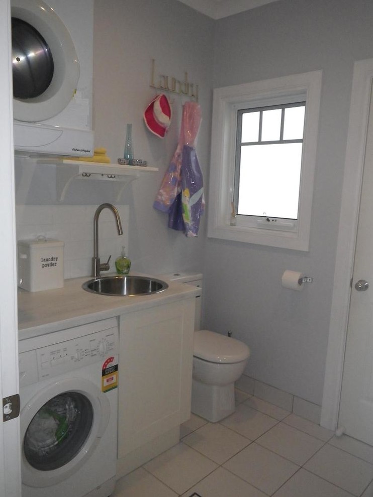 Photo of a small country single-wall utility room in Sydney.