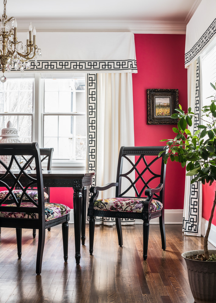 Inspiration for a mid-sized eclectic separate dining room in St Louis with red walls, medium hardwood floors and brown floor.