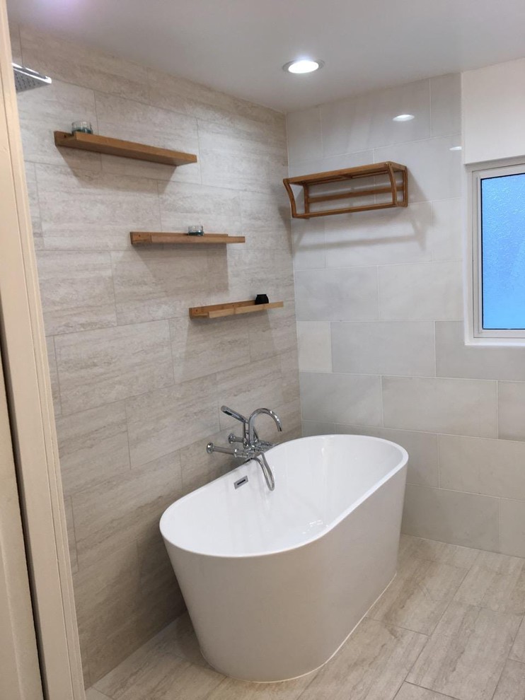Mid-sized contemporary master bathroom in Los Angeles with furniture-like cabinets, light wood cabinets, a freestanding tub, a corner shower, beige tile, porcelain tile, wood benchtops, an open shower and brown benchtops.