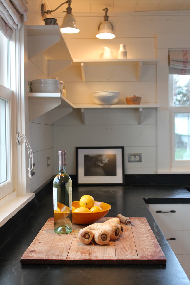 Photo of a country kitchen in Portland Maine with open cabinets and white cabinets.