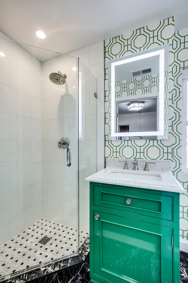 Small traditional 3/4 bathroom in DC Metro with beaded inset cabinets, green cabinets, a corner shower, a one-piece toilet, white tile, marble, marble floors, an undermount sink, marble benchtops, black floor, a hinged shower door and white benchtops.