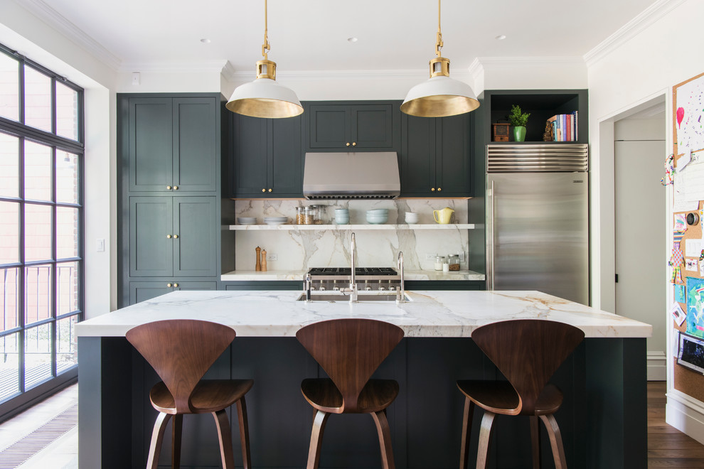 This is an example of a mid-sized contemporary galley eat-in kitchen in Raleigh with an undermount sink, shaker cabinets, grey cabinets, stainless steel appliances, with island, medium hardwood floors, marble benchtops, grey splashback, stone slab splashback and brown floor.