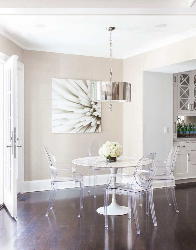 Transitional kitchen/dining combo in New York with beige walls and dark hardwood floors.