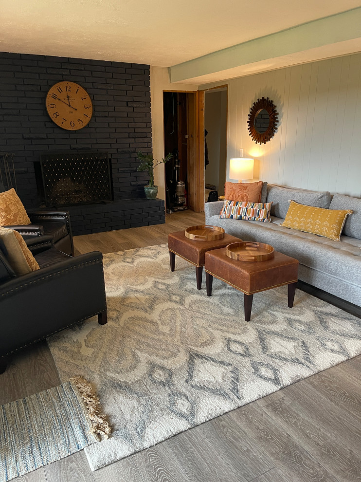 Family room - mid-sized transitional enclosed gray floor and wall paneling family room idea in Portland with gray walls, a standard fireplace and a brick fireplace