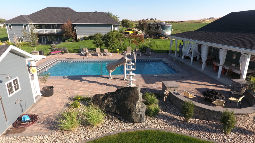 Pool house - mid-sized transitional backyard brick and rectangular lap pool house idea