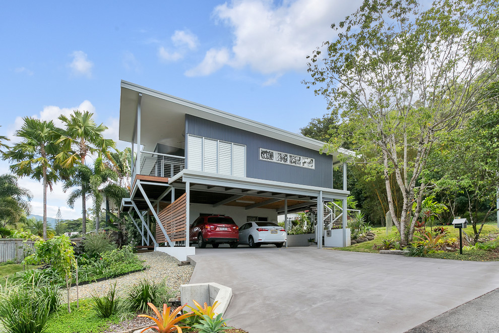 Inspiration for a contemporary two-storey grey house exterior in Cairns with mixed siding and a shed roof.