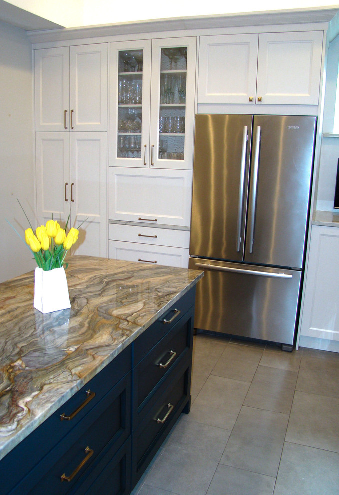 Inspiration for a large transitional u-shaped ceramic tile and gray floor eat-in kitchen remodel in Denver with a double-bowl sink, recessed-panel cabinets, white cabinets, granite countertops, white backsplash, marble backsplash, stainless steel appliances, an island and multicolored countertops