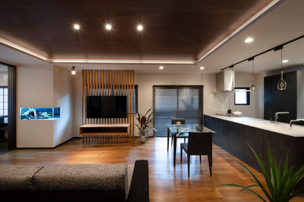 Esempio di un soggiorno design con TV a parete