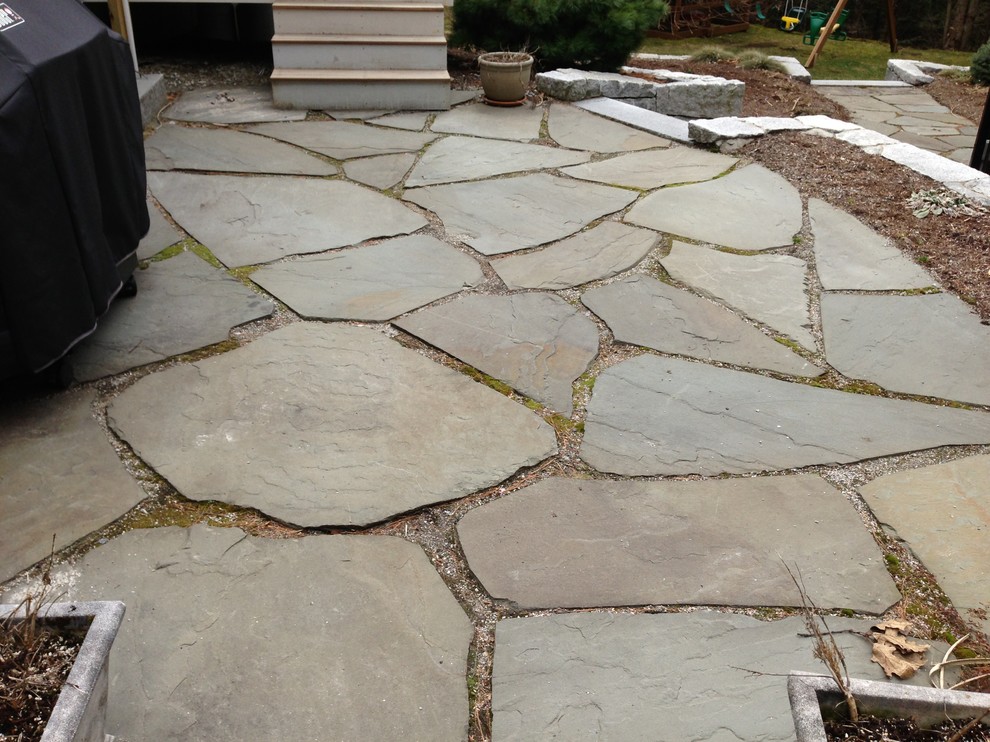 Design ideas for a garden in Manchester with natural stone pavers.
