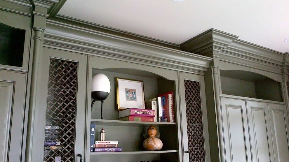 Example of a large transitional built-in desk medium tone wood floor home design design in Toronto with brown walls