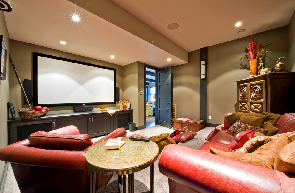 Photo of a contemporary enclosed home theatre in Calgary with a wall-mounted tv.