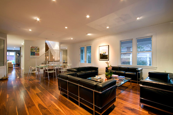 Photo of a mid-sized modern open concept living room in San Francisco with medium hardwood floors and brown floor.