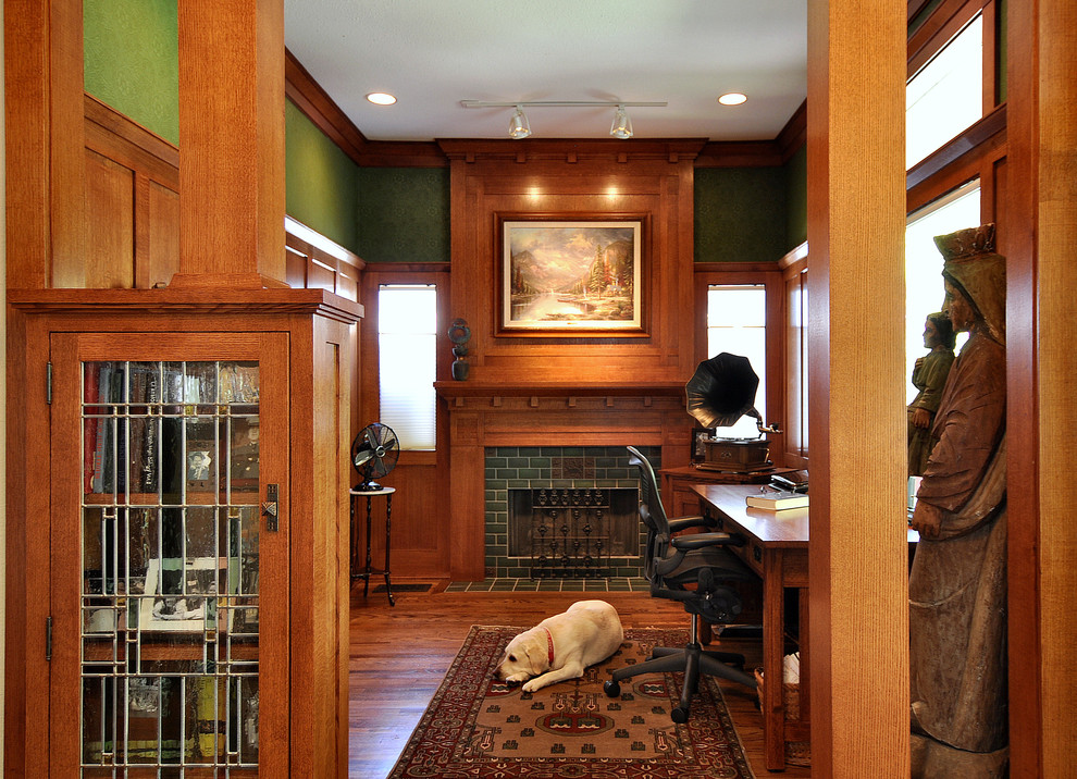 Inspiration for an arts and crafts home office in Dallas with green walls, a tile fireplace surround and a standard fireplace.