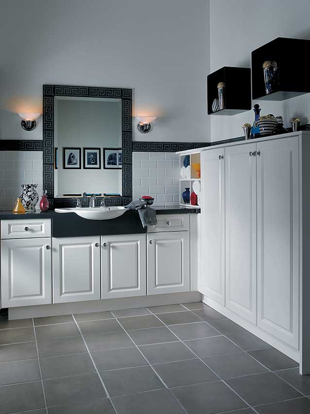 Example of a mid-sized transitional master gray tile, white tile and subway tile ceramic tile bathroom design in Jackson with raised-panel cabinets, white cabinets, white walls, a vessel sink and solid surface countertops