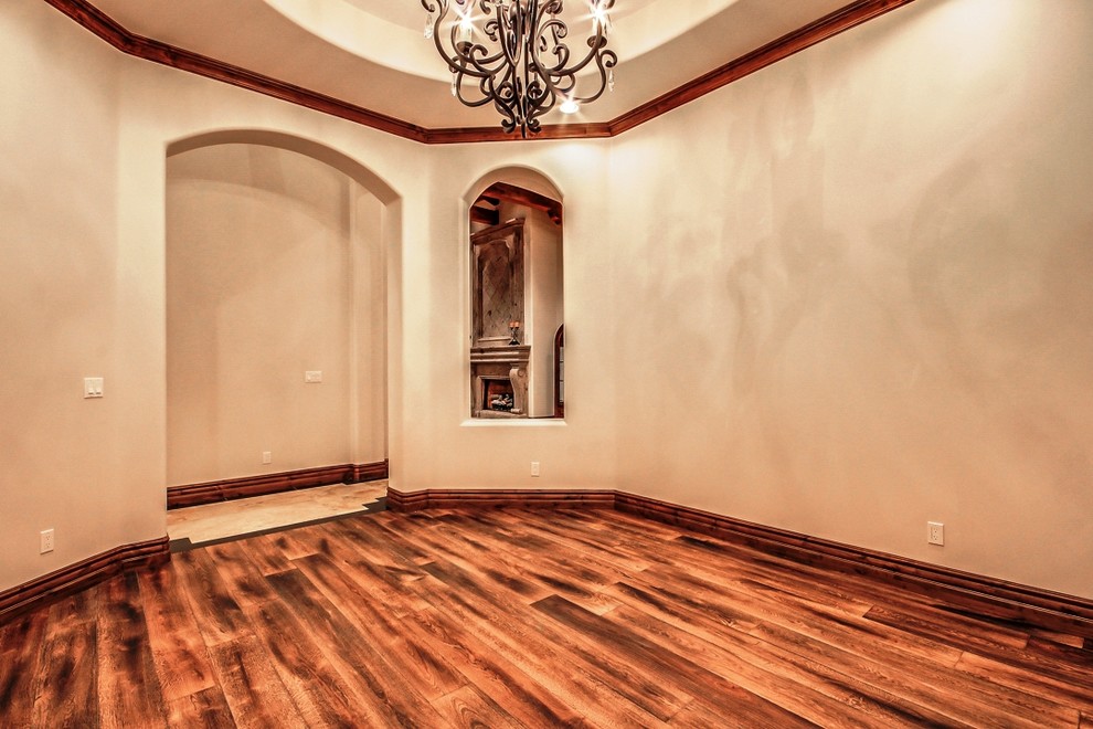 Photo of a mid-sized arts and crafts separate dining room in Phoenix with beige walls, medium hardwood floors and no fireplace.