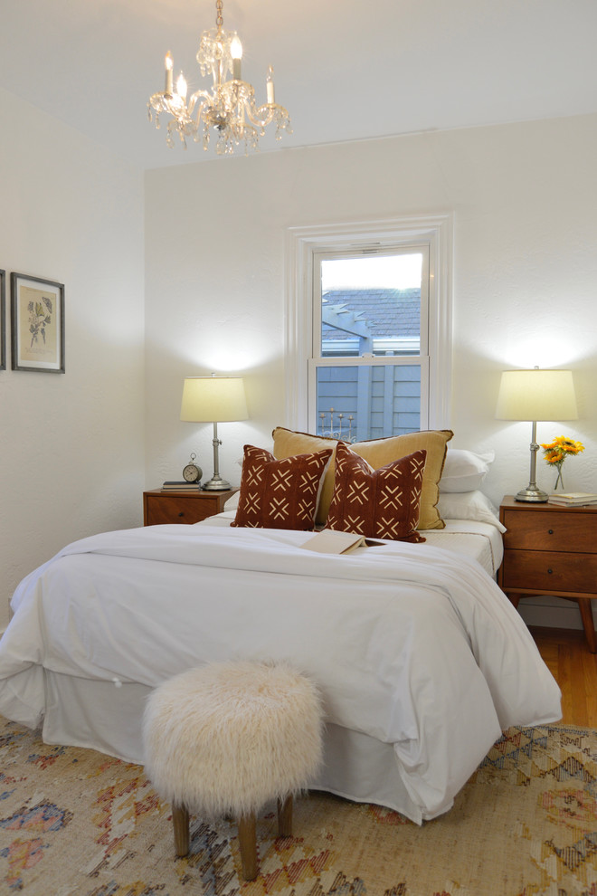 Design ideas for a scandinavian bedroom in San Francisco with beige walls, medium hardwood floors and beige floor.