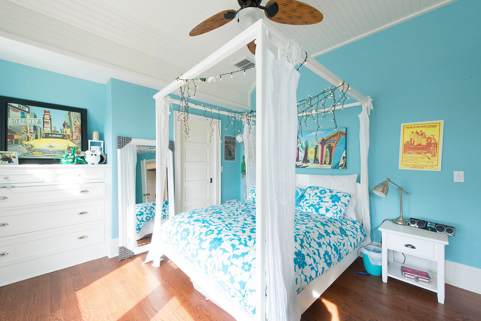 Tropical bedroom in New York with blue walls.