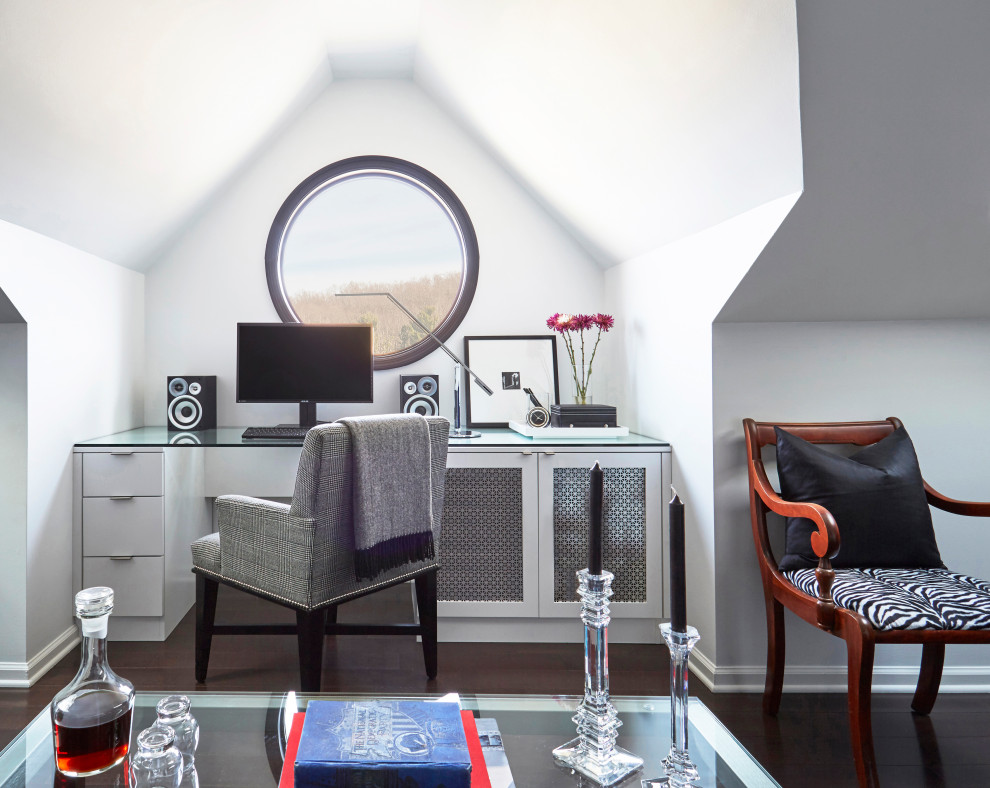 Transitional home office in Chicago with grey walls, dark hardwood floors, brown floor and vaulted.