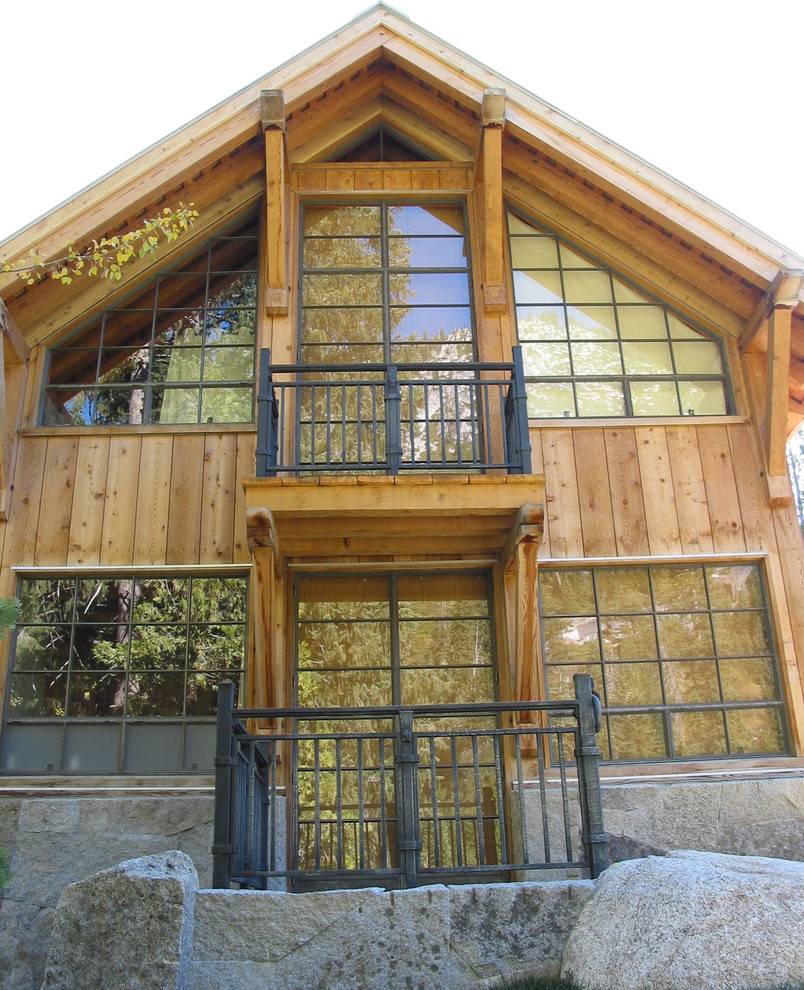 Inspiration for a large rustic brown two-story wood gable roof remodel