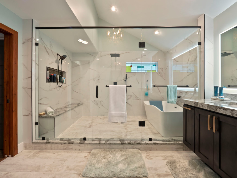 Photo of a large midcentury master bathroom in Other with shaker cabinets, dark wood cabinets, a freestanding tub, a double shower, a two-piece toilet, white tile, ceramic tile, green walls, wood-look tile, an undermount sink, engineered quartz benchtops, beige floor, a hinged shower door, grey benchtops, a shower seat, a double vanity, a floating vanity and vaulted.