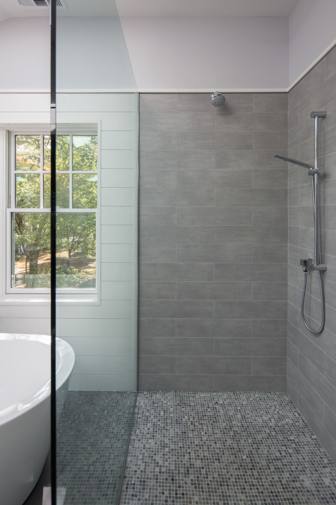 Freestanding bathtub - large transitional master gray tile and porcelain tile porcelain tile freestanding bathtub idea in Boston with recessed-panel cabinets, gray cabinets, a one-piece toilet, blue walls, an undermount sink and quartzite countertops
