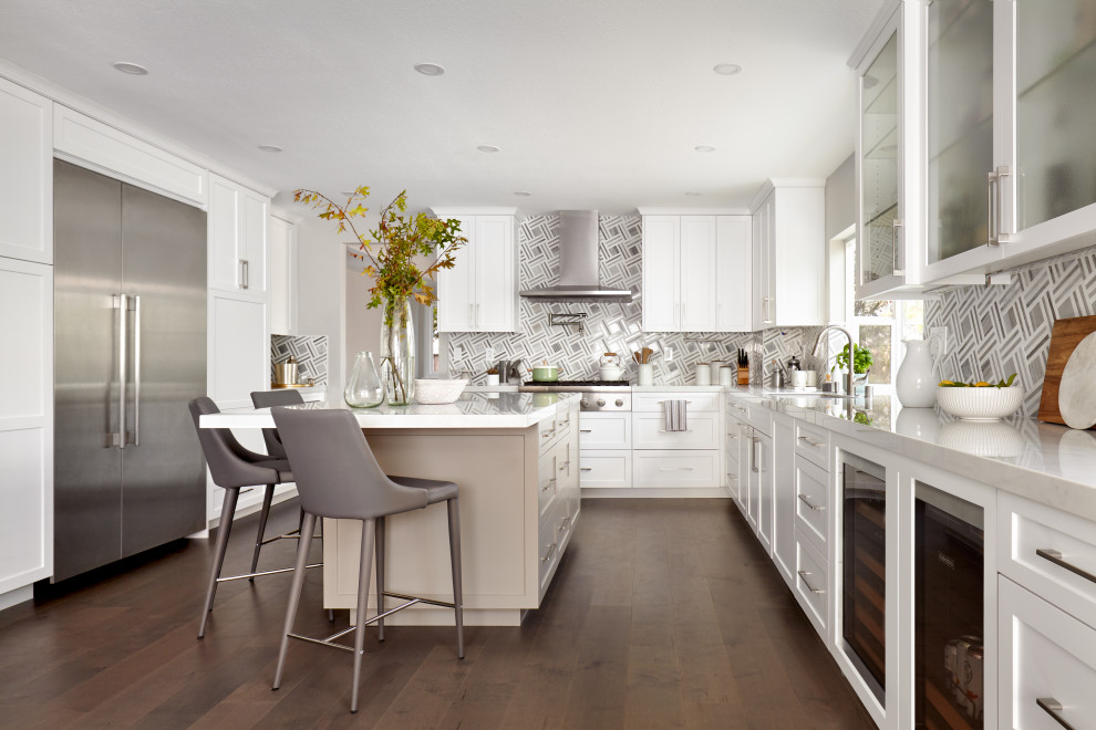 Inspiration for a large transitional u-shaped dark wood floor and brown floor eat-in kitchen remodel in San Francisco with an undermount sink, shaker cabinets, white cabinets, multicolored backsplash, porcelain backsplash, stainless steel appliances, an island and gray countertops