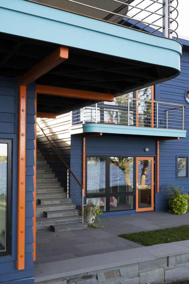 Diseño de fachada de casa azul bohemia de tres plantas