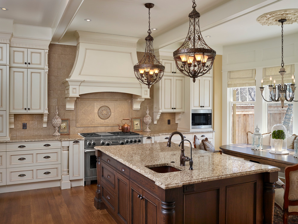 Design ideas for a traditional l-shaped separate kitchen in Calgary with an undermount sink, recessed-panel cabinets, beige cabinets, granite benchtops, beige splashback, cement tile splashback, stainless steel appliances, dark hardwood floors and with island.